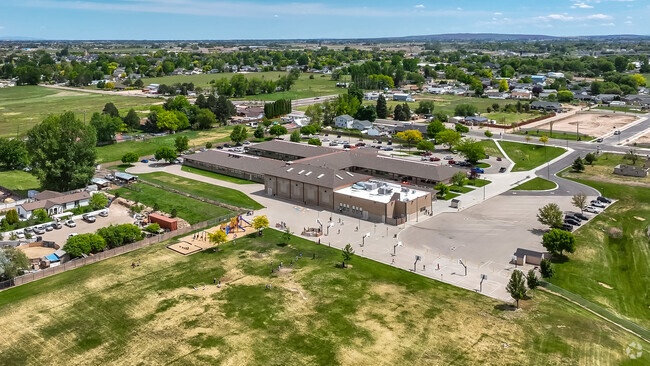 Students enjoy the open courts and acres of green space at Endeavor Elementary for recess.