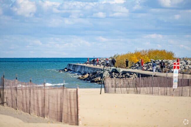 A boardwalk extends out onto the breakwater for sightseeing at North Beach Oasis.