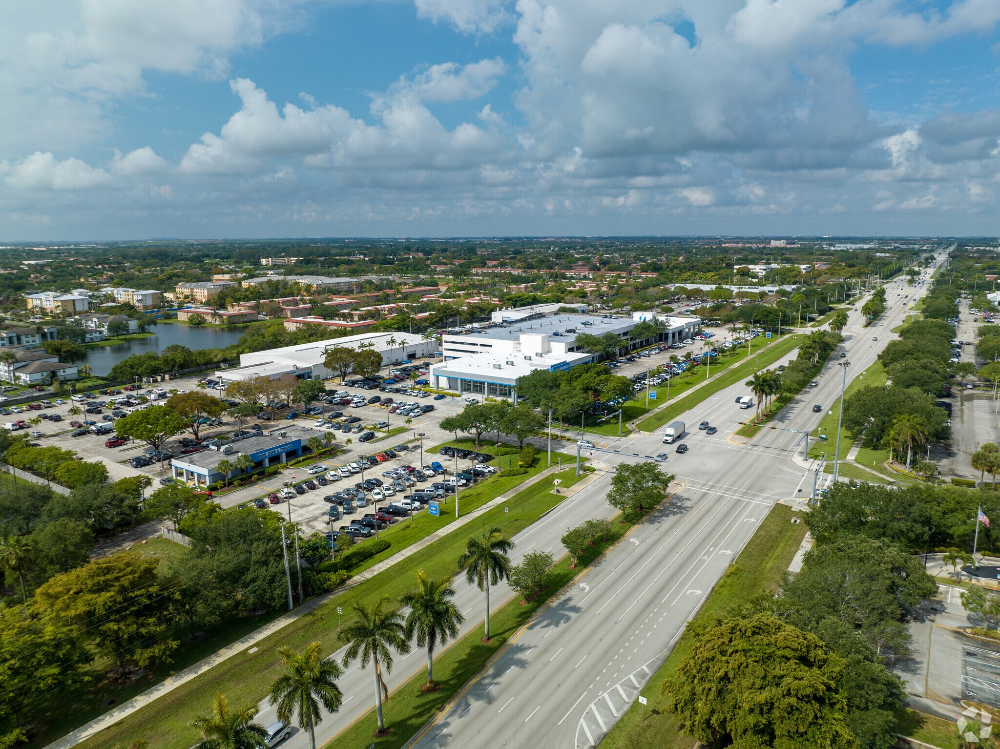 Car dealerships line the borders of Pines Boulevard.