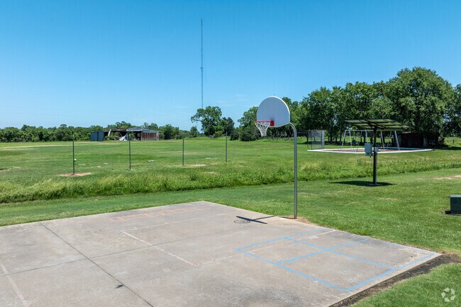 Students enjoy outdoor basketball courts at Fields Store Elementary School.