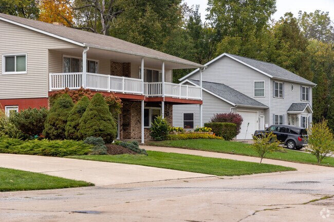 Looking down the street at larger homes and manicured yards in Ginger Hill.