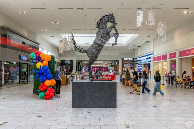 Visitors to South Plains Mall in Lubbock are busily making their way through its corridors.