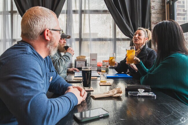 These friends share some laughs and a pint at Science Project Brewing Company after work in downtown Logansport.