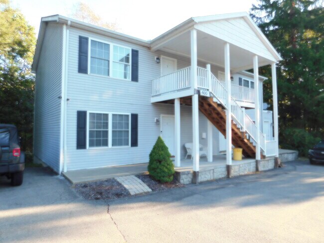 FRONT OF BUILDING GROUND APARTMENT ON LEFT