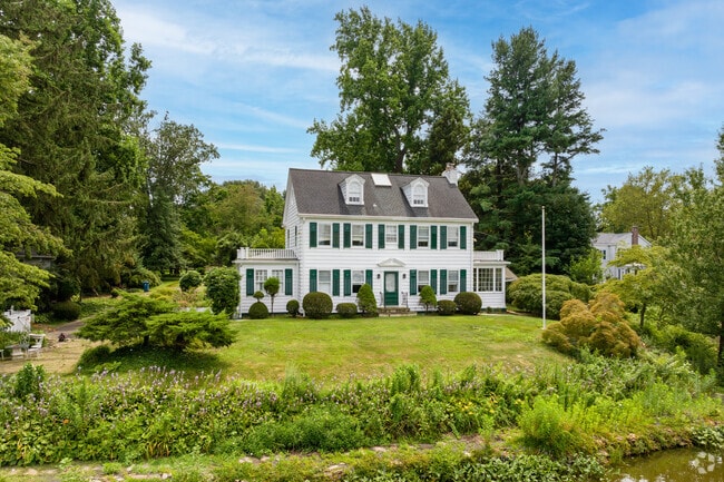 Large colonial homes sit on the shore of Brainerd Lake in Cranbury.