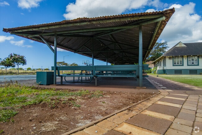 An outdoor picnic area is shaded at Lanakila Baptist School's inspiring campus.