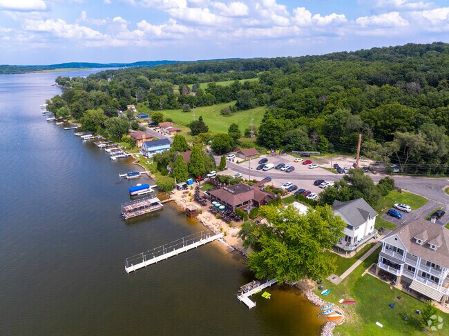 Boats rest near Mars Resort’s inviting lakeside patio on Lake Como in Lake Geneva.