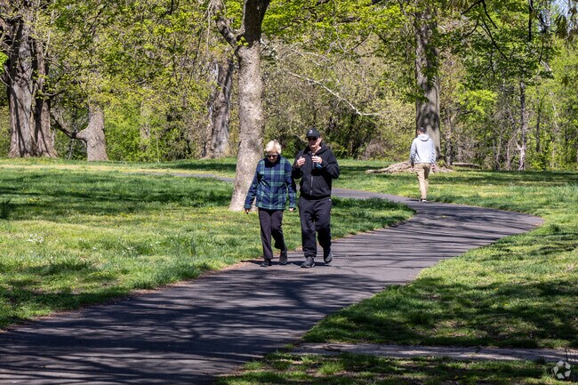 Take a walk in Fluehr Park on the paved trail.