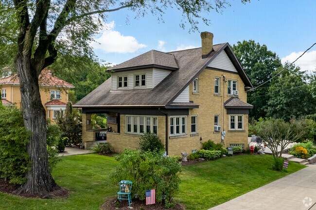 Lincoln has shingle style homes on green lots.