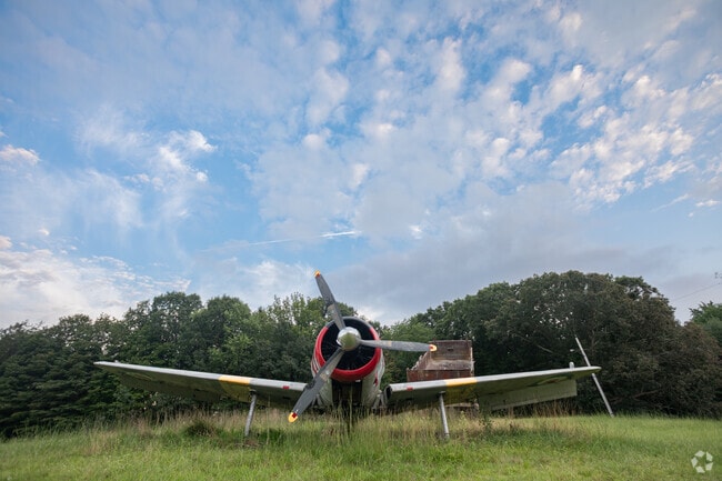 Land owner and farmer Rudy displays on his property some of his toys recently acquired in Granby.