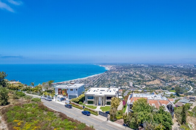 Custom homes crown Mt. Soledad, offering stunning views in La Jolla.