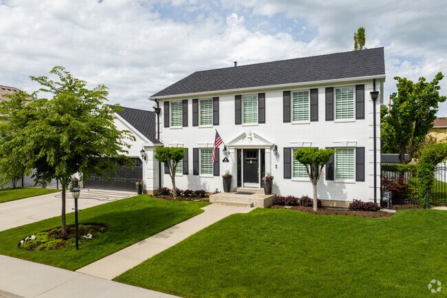A white home in Hillcrest exudes a timeless and elegant aesthetic.