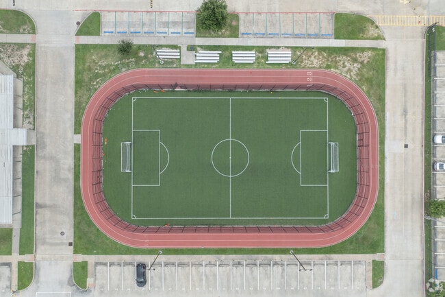The campus includes facilities for sports and extracurricular activities.