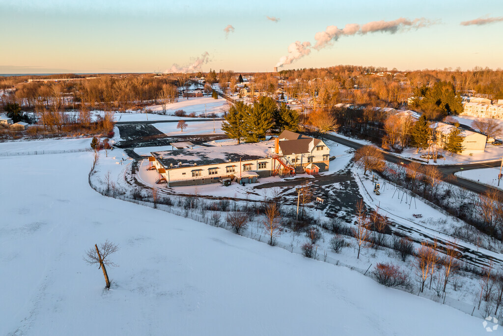 Oswego Community Christian School in Oswego can be seen with the Nine Mile Nuclear Plant behind.