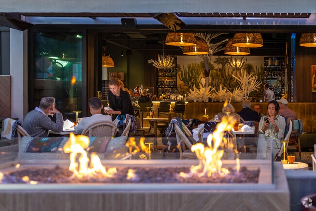 Enjoy a glass of wine by the fire pit at Canopy, near Gene Autry.