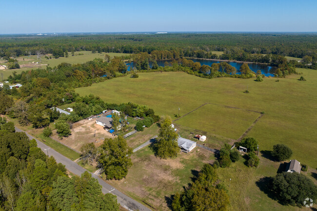 Overview of the neighborhood countryside with farms and lakes.