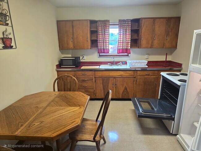 LARGE KITCHEN... SELF-CLEANING STOVE....FULL SIZE REFRIGERATOR WITH PLENTY OF CABINETS!