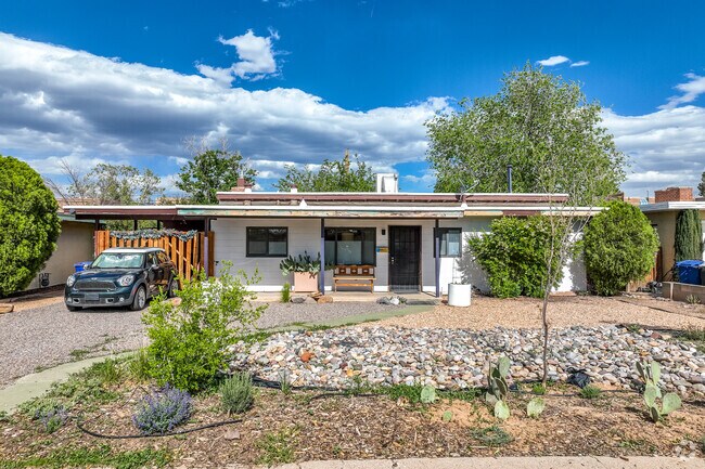 The front and backyards of Highland Business homes are speckled with tall drought-resistant trees and shrubs.