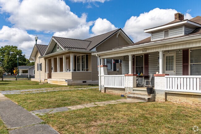 Siding-clad homes have large front porches that embrace a small-town feel.