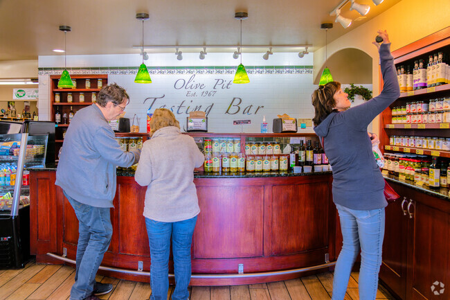 A group of friends try a plethora of unique olives at the Olive Pit Tasting Bar in Corning.