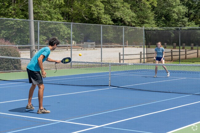 Enjoy a game of tennis on the open courts of Bishop Park near Cobbham.