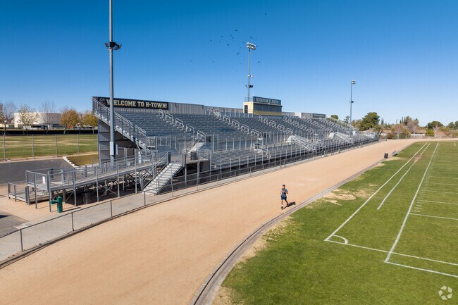 Hesperia High student running on the track and training for the big moments.