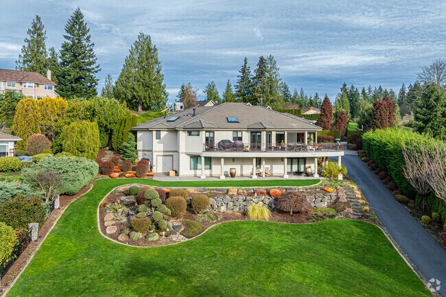 Some Atkinson homes have manicured lawns, shrubbery, and are set amid thick forests.