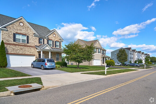 Rows of homes line a quiet street in the private community of Collegiate Acres.