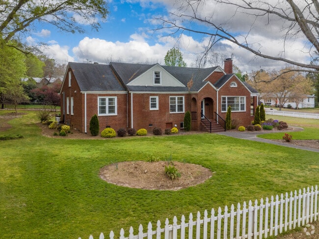 Beautiful brick ranches have stood for years in green grassy yards in Pendleton, SC.