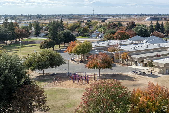 Shade trees surround the playground at William Saroyan Elementary School.