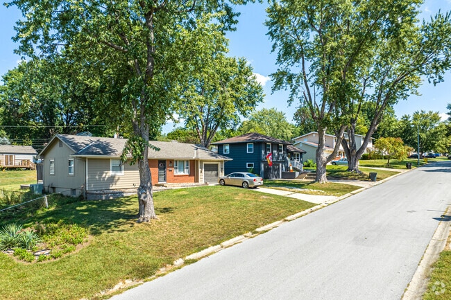 Hanthorn neighborhood is lined by large trees.