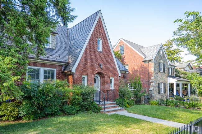 A line of Tudor style homes on a shady, quiet street in Cleveland Park.