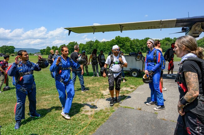 Skydivers at Skydive The Ranch in Gardiner go over last minute maneuvers before boarding.