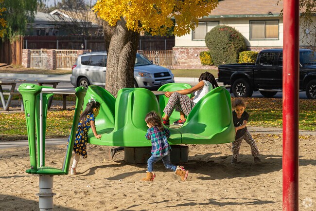 Southgate children enjoy spinning around on the park play equipment.