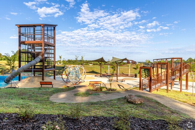 Reynolda Forest/Salem Lake children enjoy the creative playground at The Quarry at Grant Park.