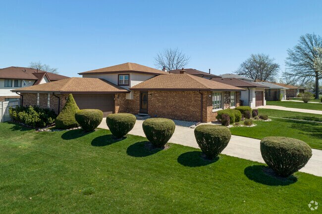 Manicured lawns and trimmed bushes are a common sight in East Fernway Park.