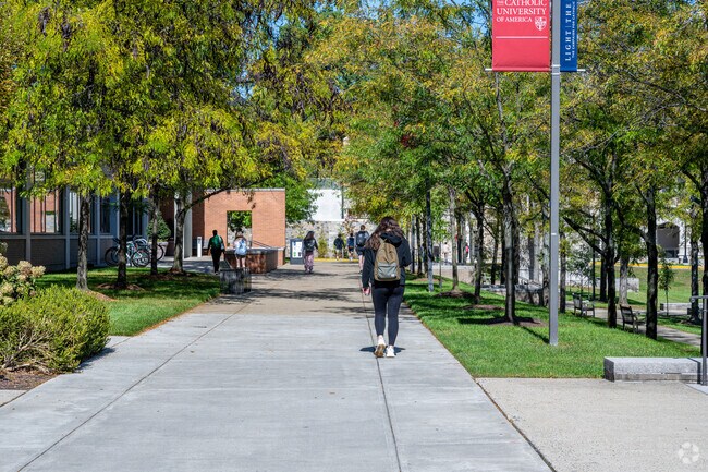 Students walking on campus at Catholic University.