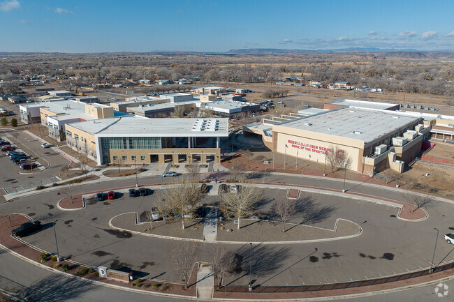 Bernalillo High School features a large student lot.