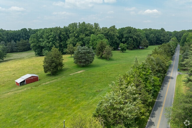 Pastureland unfolds beside a winding country road in scenic Browns Summit.