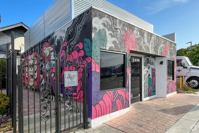 Colorful Japanese murals on retail building on Alum Rock Ave in Little Portugal.
