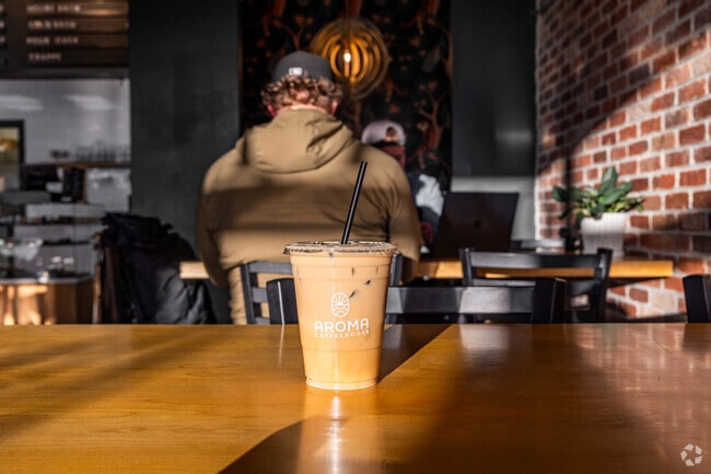 Grab a coffee from Aroma, just around the corner from Orchard Park.