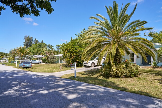 North River Shores is surrounded by greenery and most lots are adorned with small palm trees.