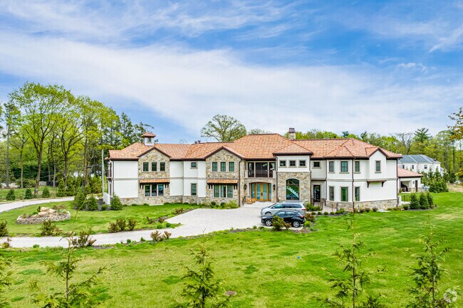 This alluring Spanish Revival-style mansion is found in Muttontown, New York.
