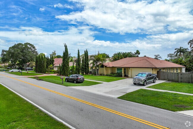 Large driveways are common in Paddock Park of Wellington neighborhood.
