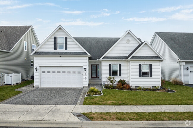 This modern take on a traditional cottage features a two-car garage.