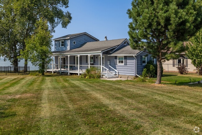 Custom lake homes line Nicolet Drive along Lake Michigan's shore.