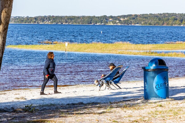 Residents love to sit on the beaches of Lake Minneola in Waterfront Park in Clermont.