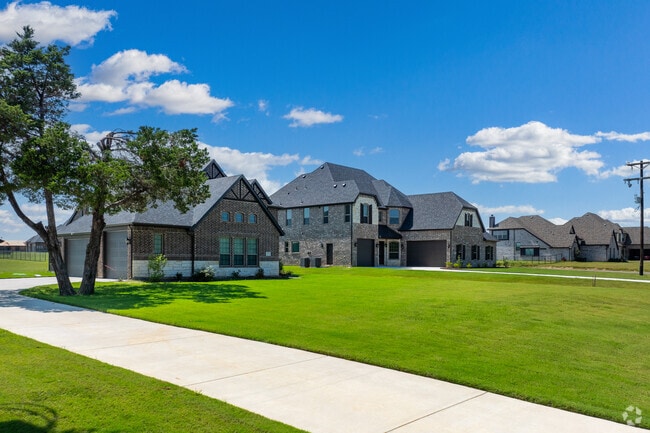 New Traditional homes line spacious yards in Whitesboro.