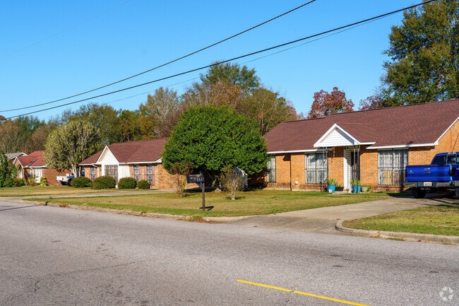 Modest brick homes display well-kept lawns in North Montgomery.