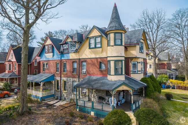 Victorian-style homes in Lansdowne, PA have about three-story interiors with stone siding.